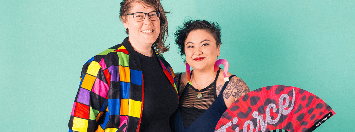 Smiling queer women who are happy to read the An A to Z Guide Of HPV For LGBTQ+ Folks 